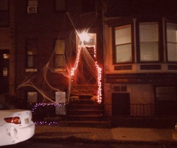 halloween house webs in front of door